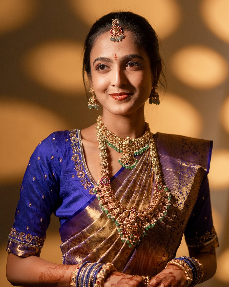 Bridal makeup with blue and gold silk saree
