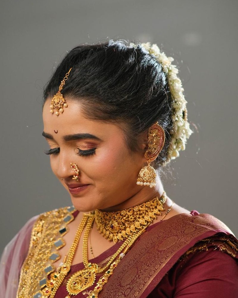 Bridal makeup close-up with floral hair accessory